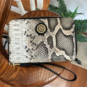 Snakeskin printed wristlet.